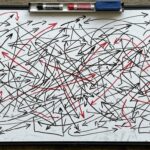 A stark top-down view of an empty tactical whiteboard covered in intersecting arrows.